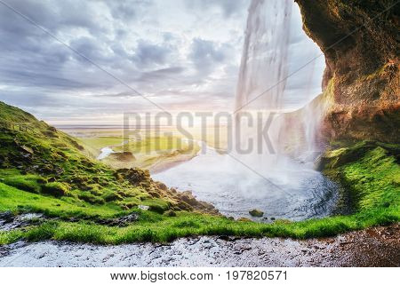 Seljalandfoss Waterfall At Sunset. Bridge Over The River. Fantastic Nature. Iceland