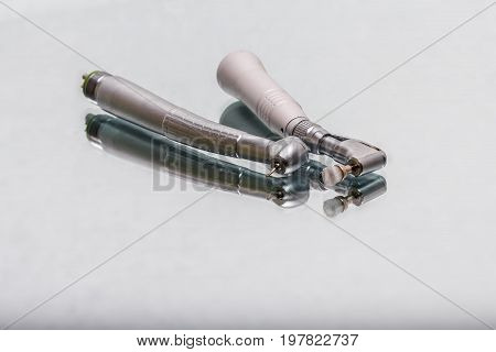 dental and endodontic instruments on the mirror. Top view