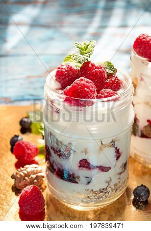 Healthy Breakfast - Dessert With Yogurt, Granola, Outs Flakes, Jam, Raspberries, Blueberries, Hazeln