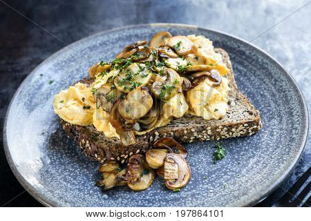 Scrambled eggs and mushrooms on wholewheat toast.