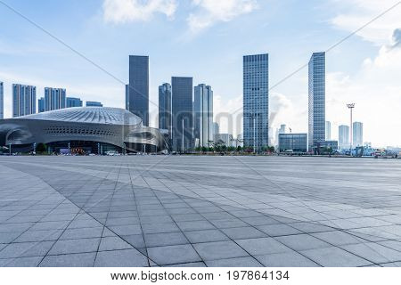 empty square and city skyline under blue sky,tianjin city,china.