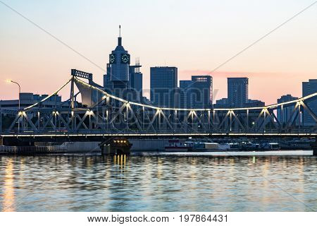 Tianjin city waterfront downtown skyline with Haihe river,China.
