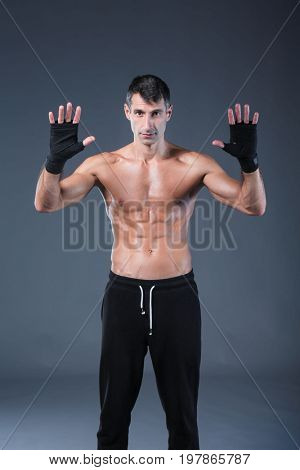 portrait of hand wrapping half nude boxer. Personal fitness instructor. Personal training.