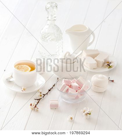 tea ceremony set with pink flowers and marshmellow