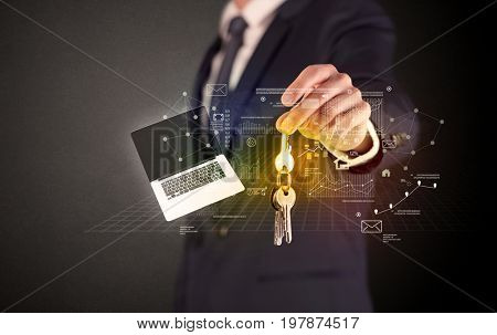 Businessman in suit holding keys with statistics, graphs and icons around