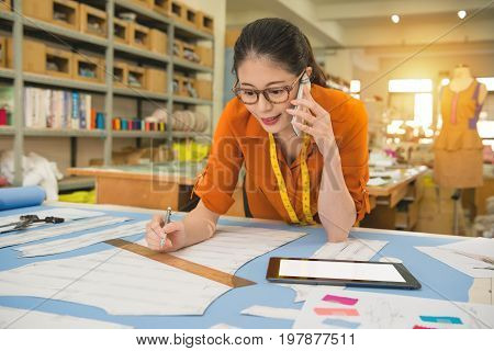 Woman Designer Talking On The Mobile Phone