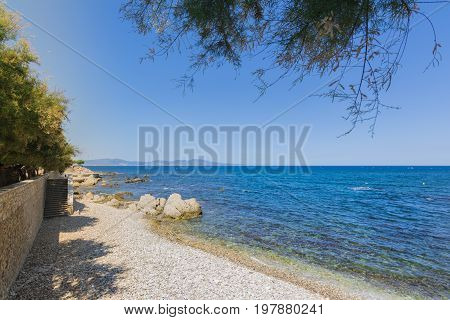 Rocky beach of Costa Brava in beautiful town of l'Escala, Spain.