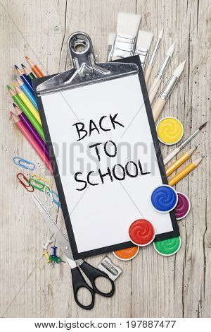 School Accessories On A Wooden Background
