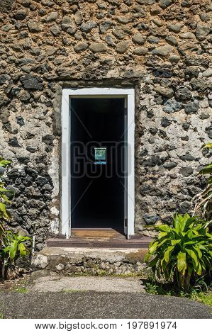 A view a door of the old church at Keanae Point on Maui Hawaii.