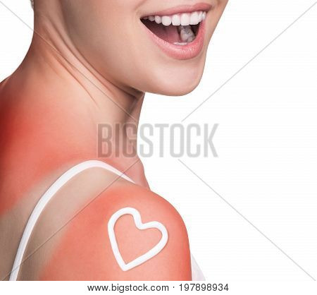 Sunblock on the female shoulder isolated on white. Body care concept.