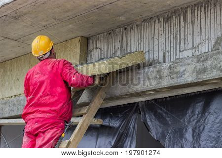 Man Installing External Wall Insulation 2