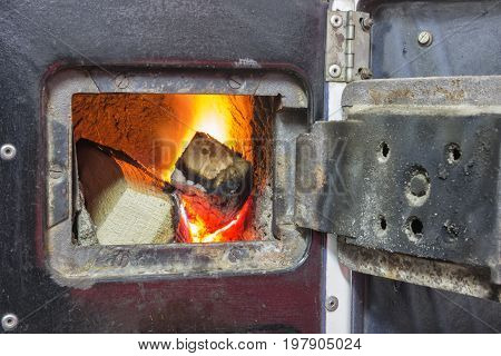 Wood Stove Firebox With Fire And Wood 2