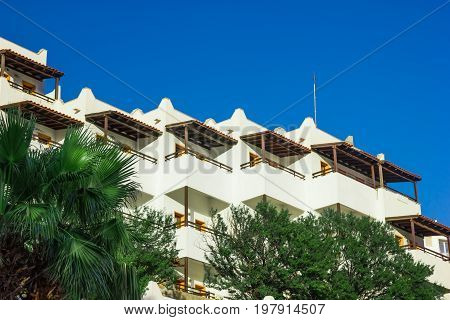 View of white houses with balconies in Turkey. Typical architecture in the city of Bodrum.