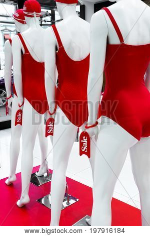 A Series Of Mannequins In Red Swimsuits.sale