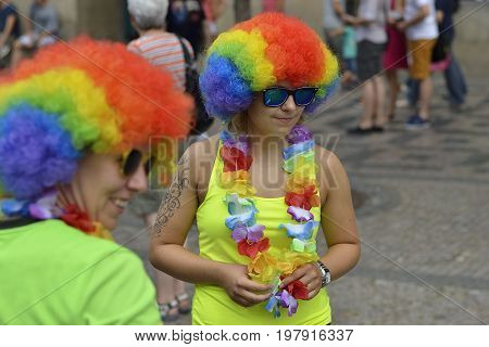 Prague, Czech Republic, 15 August, 2015, Editorial photo of two girls who is wearing fancy festival dress with rainbow wig, Prague, Czech Republic, St. Wenceslaus square