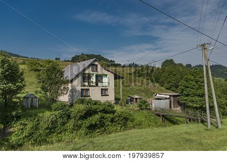 House in Lesnica village in Pieniny national park in hot summer morning