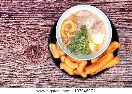 Pork's Rice Porridge Served With Deep-fried Dough Stick.