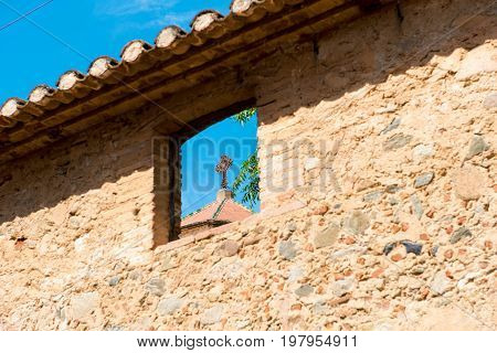 Forged Cross On A Blue Sky Background In Montbrio Del Camp, Tarragona, Catalunya, Spain.