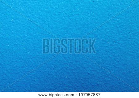 The wall is painted with blue paint