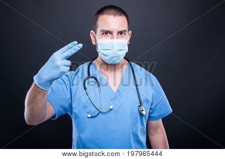 Portrait Of Proctolog Wearing Latex Gloves Gesturing Procedure