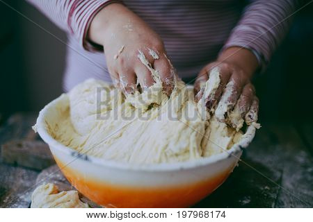 Close Up View Of Baker Kneading Dough. Homemade Bread. Hands Preparing Bread Dough On Wooden Table.