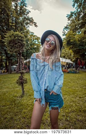 Portrait of fashion hipster woman posing. Festival Vibes