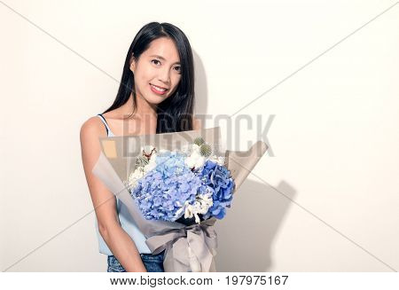 Young Woman holding bouquet of flower