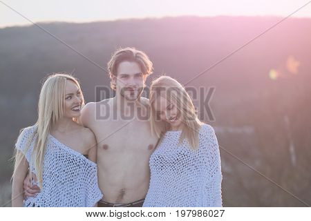 Beauty and fashion. Blonde and guy with athletic chest. Girl and women with boyfriend outdoor. Man with muscular body with twins. Love and romance.