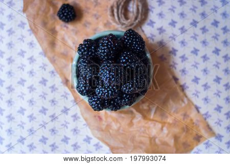 Homemade, sweet, delicious blackberries in a handmade dish
