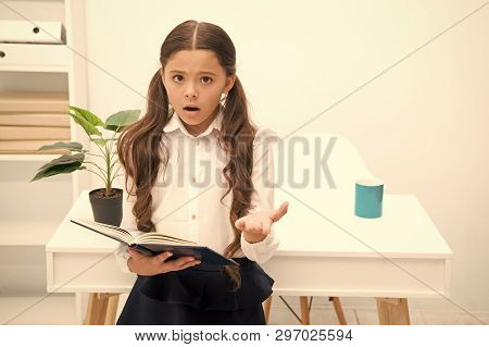 Such Difficult Topic. Studying Difficulties. Girl Read Book While Stand Table White Interior. School