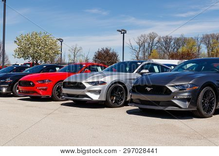 Noblesville - Circa April 2019: Mustang Display At A Ford Car And Truck Dealership. Ford Sells Produ