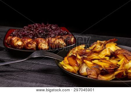Fried Homemade Grilled Sausages Or Chevapchichi With Stewed Sauerkraut On A Wooden Rustic Background