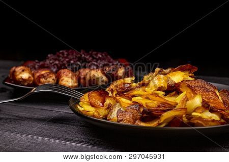 Fried Homemade Grilled Sausages Or Chevapchichi With Stewed Sauerkraut On A Wooden Rustic Background