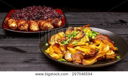 Fried Homemade Grilled Sausages Or Chevapchichi With Stewed Sauerkraut On A Wooden Rustic Background