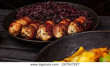 Fried Homemade Grilled Sausages Or Chevapchichi With Stewed Sauerkraut On A Wooden Rustic Background