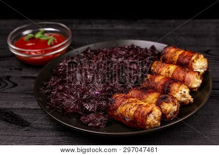 Fried Homemade Grilled Sausages Or Chevapchichi With Stewed Sauerkraut And Tomato Sauce On A Wooden 