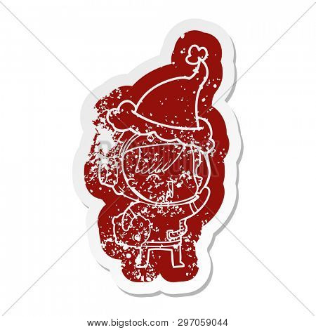 quirky cartoon distressed sticker of a happy spacegirl holding moon rock wearing santa hat