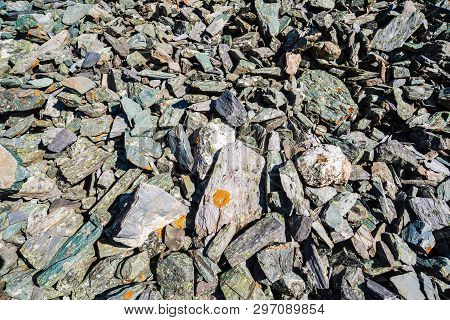 Natural Texture Of Mountain Of Friable Boulders Close Up. Detailed Background Of Gray Stones With Or
