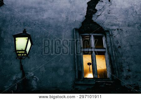 Window With A Crack And Street Lamp In The Evening In One Of The Small Streets Of Bratislava Old Cit