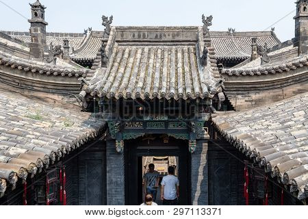 Aug 2013 - Pingyao, Shanxi Province, China - Tiled Roofs Door In One Of The Courtyards Of Ri Sheng C