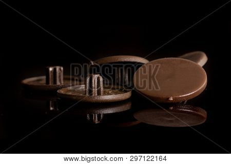 Group Of Five Whole Brown Plast Masking Plugs Work Item Isolated On Black Glass