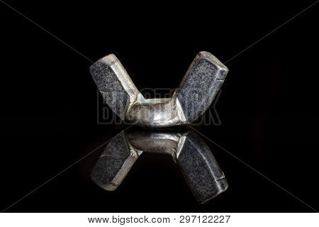 One Whole Metal Wingnut Work Item Isolated On Black Glass