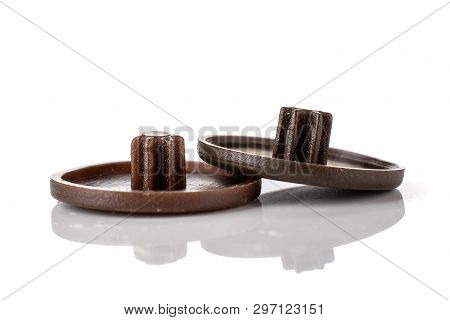 Group Of Two Whole Dark Brown Plast Plugs Work Item Isolated On White Background