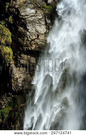 Waterfall Cascade, Natural Water Background. Beautiful Detailed Texture Of Flowing Water And Wet Sto