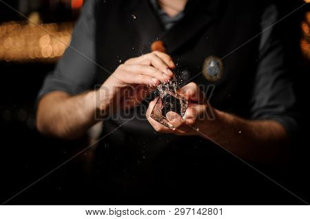 Close-up Of Bartender Crushing Ice With Ice Crusher