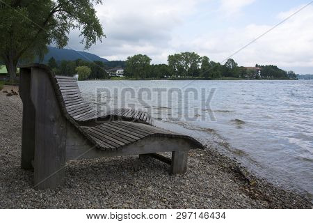 Benches At The Waterfront At Lake Tergensee In Germany On A Cloudy Afternoon