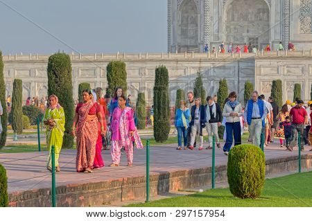 Agra, India - March 5 2018: Tourists Sighteseeing, Exploring And Admiring Famous The Taj Mahal