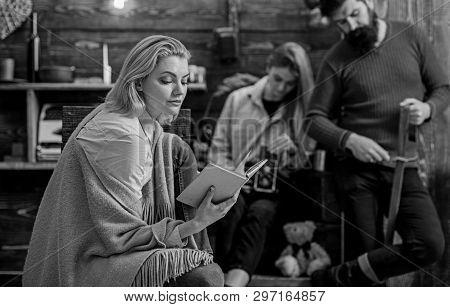Dreamy Female Reading Fascinating Book, Fantasy World Concept. Woman In Blue Shirt, Jeans And Beige 