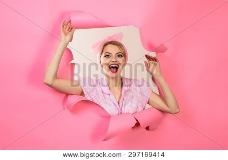 Excited Woman Dressed In Pin-up Style. Retro Fashion. Pin-up Girl Looking Through Hole In Paper. Che