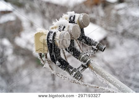 Frostbitten Satellite Dish. Satellite Dish In The Snow On Background Urban View